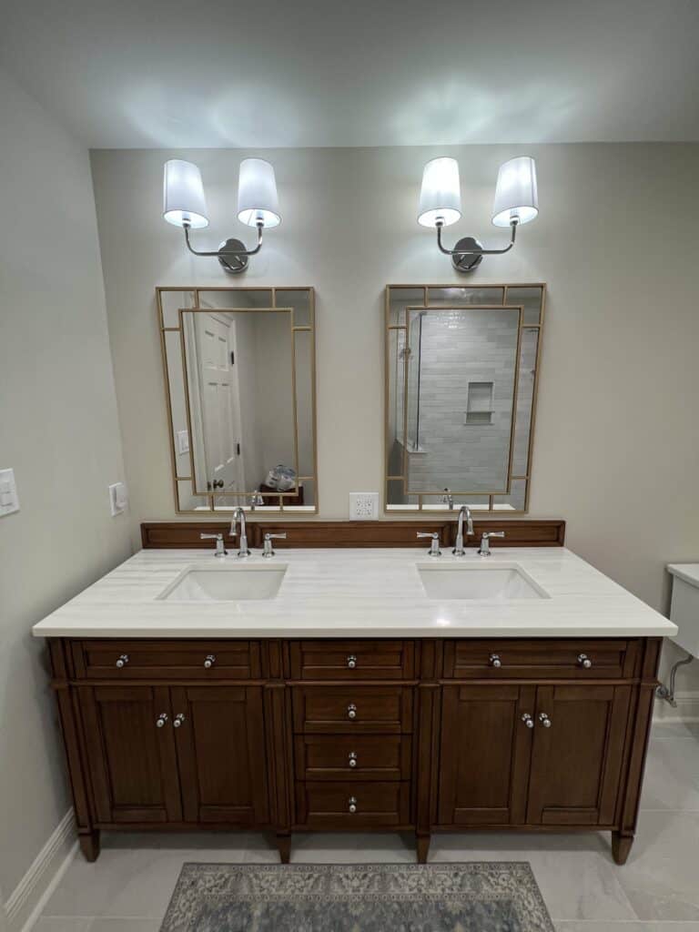 Double sink bathroom vanity with quartz countertop and wall-mounted mirrors